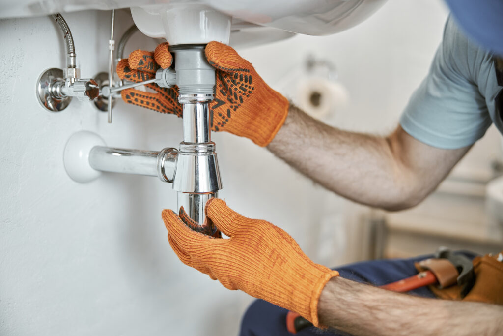Close up of young man in work - preventive plumbing tacoma wa